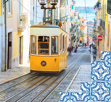 Image of a yellow Lisbon tram riding through a colorful street, a scene that students might see on “Lisbon, Seville & Madrid,” one of our popular tours