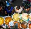 Aerial view of the colorful foods served by street vendors in Thailand, where tasting the local cuisine is an essential part of our off-the-beaten-path tour. 