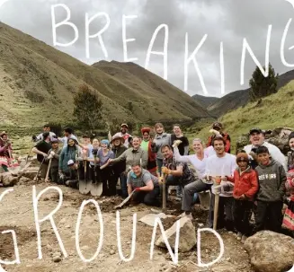 A group of students on an international Service Learning trip for high school students break ground for a new building 