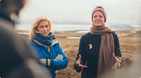 teachers talking near oceanfront