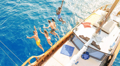 future travel programs kids jumping off boat